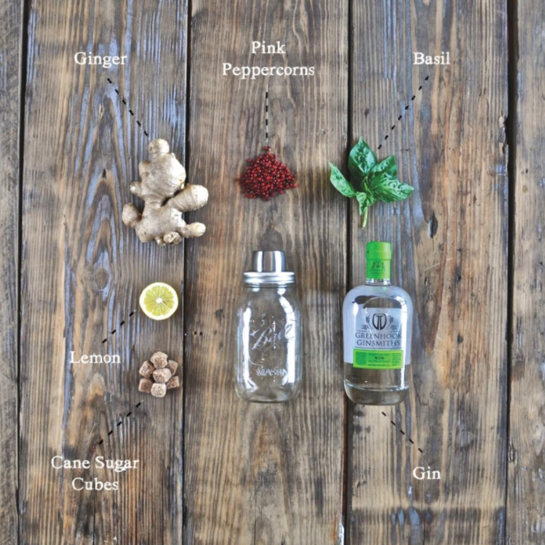 Stylish mixology book that brings bar-quality drinks into your hands. This page features ginger, pink peppercorns, bright green basil, lemon, cane sugar cubes and gin.