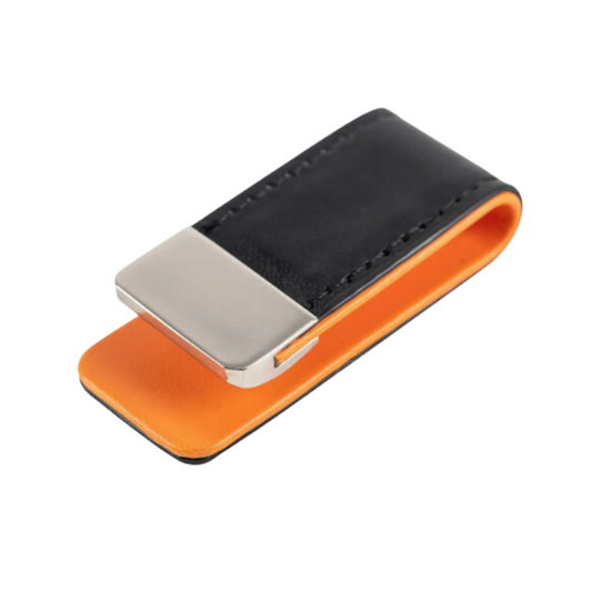 Black leather money clip with vibrant orange interior.