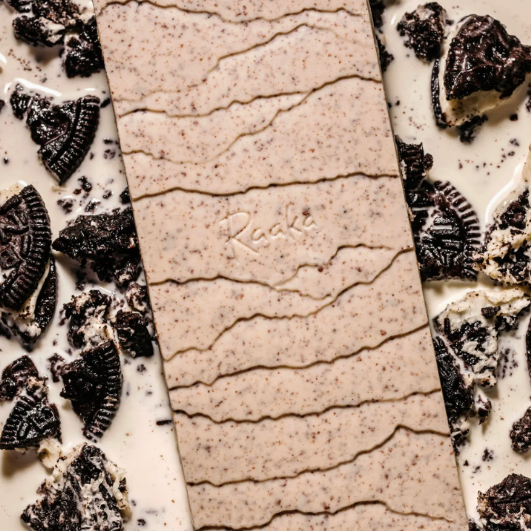 White Chocolate bar with Oreo cookie pieces on a white background.