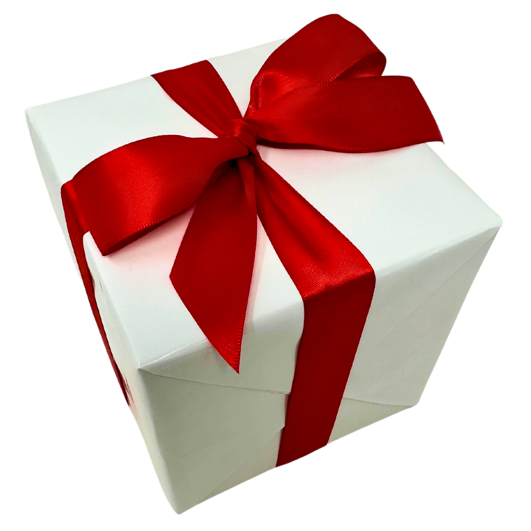 Square box wrapped in white wrapping paper and bright red satin ribbon.