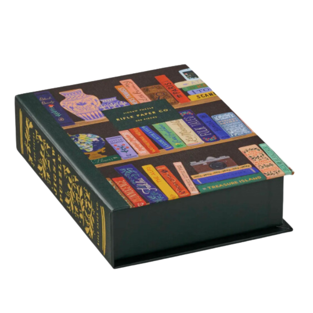 Rifle Paper Co. 500-piece Bookshelf jigsaw puzzle, ideal for puzzle enthusiasts and nature lovers, with a decorative box and vibrant colors capturing classic titles.