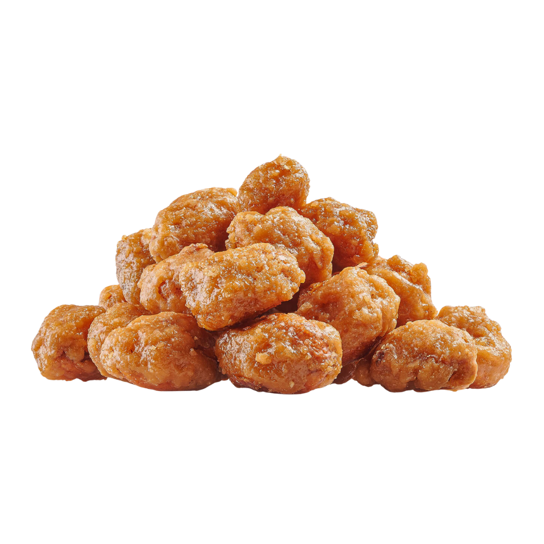 Pile of orange-brown snack nuts on a white background.