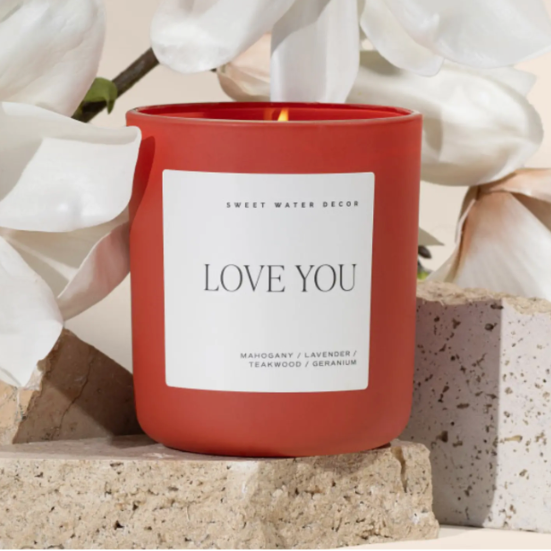 Romantic Driftwood & Mahogany Soy Candle with a blend of lavender, geranium, and teakwood. 15oz with a wood lid, offering 70+ hours of cozy burn time. Vegan and phthalate-free.