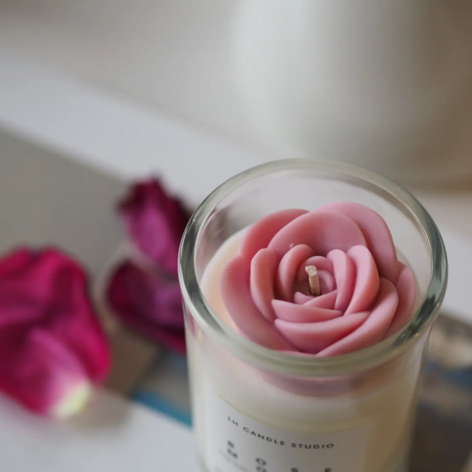 Elevate your space with a boxed soy candle in a romantic rose mood scent.