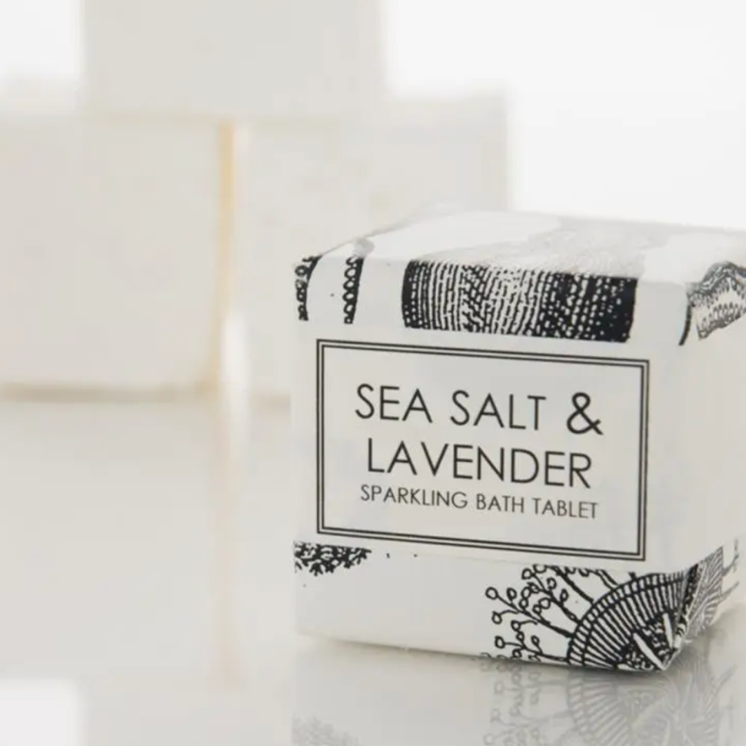 A set of two Formulary 55 Sea Salt & Lavender sparkling bath tablets, crafted with ground dead sea salts and infused with oceanic and floral aromas. These fizzing bath bombs dissolve in water, releasing soothing ingredients for a luxurious and relaxing soak.