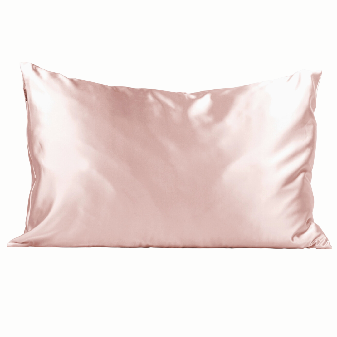 Soft blush pink satin pillowcase designed to enhance comfort for individuals undergoing breast cancer treatment. Its smooth surface helps reduce skin irritation, minimize hair breakage, and regulate temperature, offering a touch of luxury and care.