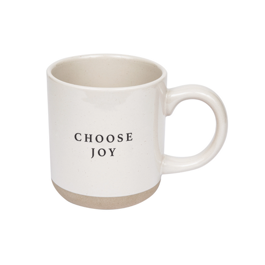 A stoneware mug with the message "Choose Joy" in elegant script, featuring a matte finish and a warm, neutral color that complements its uplifting and inspirational design.