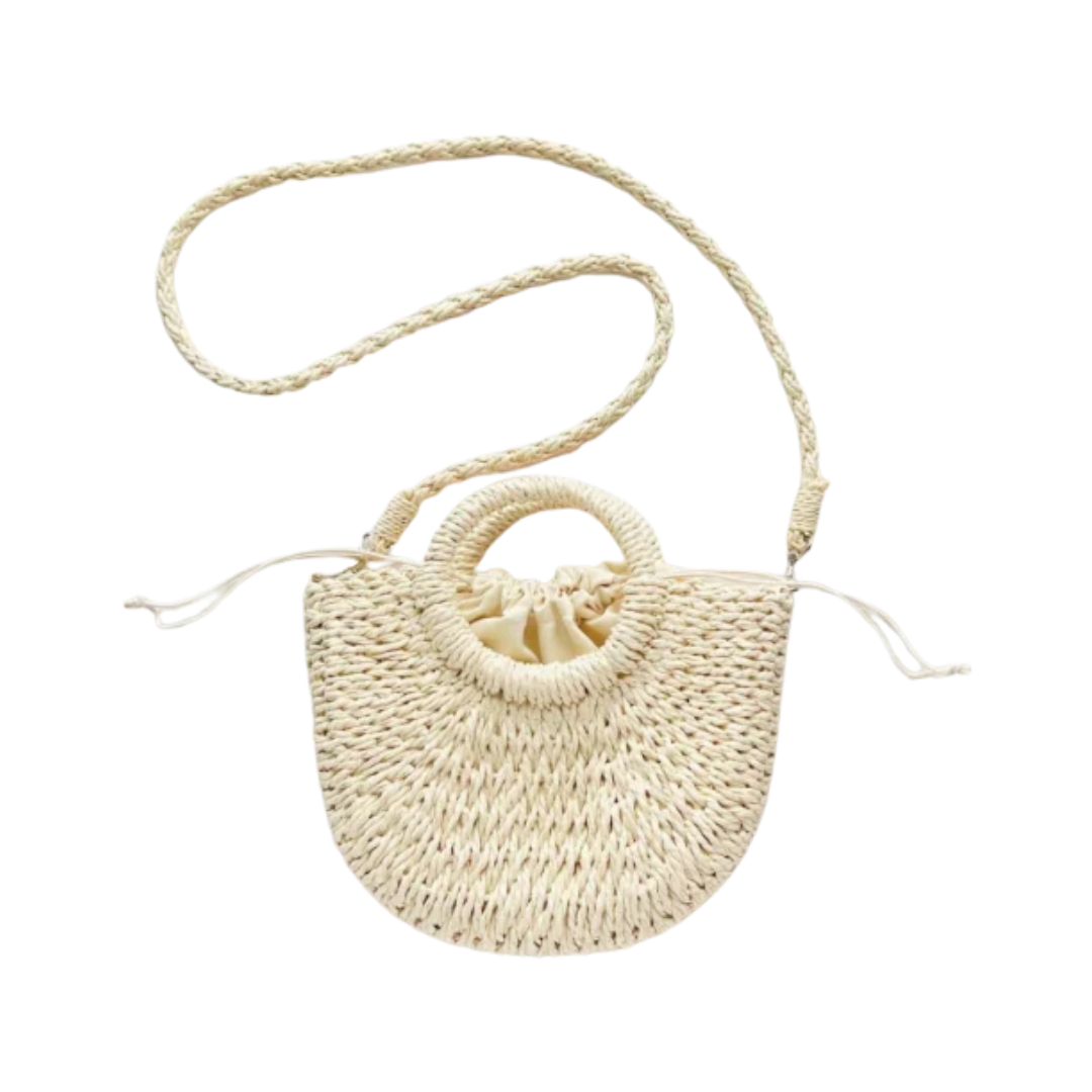 A small woven straw handbag with a circular top handle, a braided shoulder strap, and a drawstring closure at the top, shown on a plain white background.