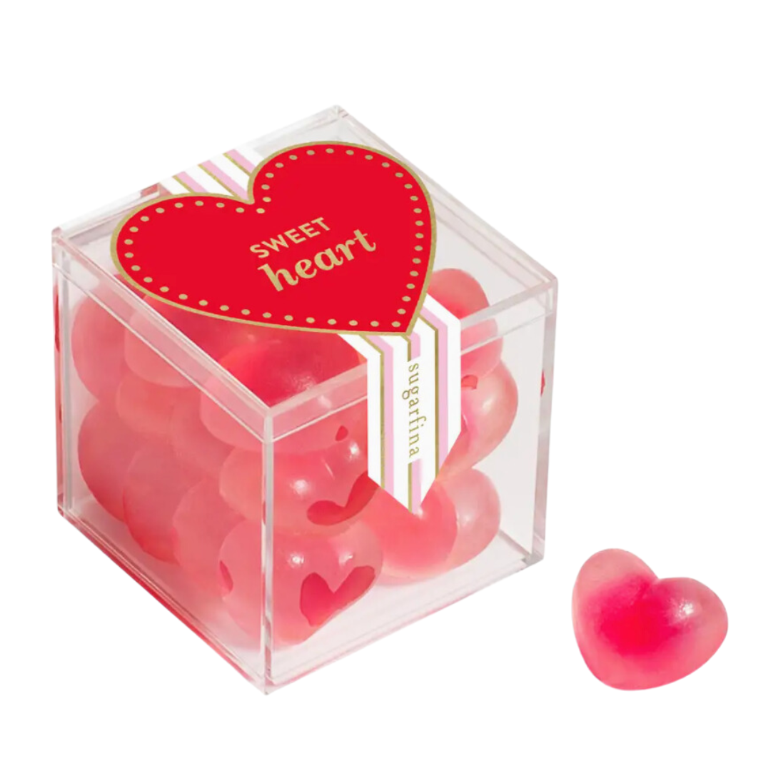 Sugarfina Sweet Heart Strawberry Gummies in a chic acrylic cube. These sweet and tangy strawberry-flavored gummy hearts are a delightful gift for romantic occasions or everyday indulgence.