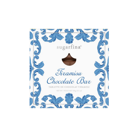 Indulge in Sugarfina's La Dolce Vita Tiramisu Chocolate Bar: A luxurious milk chocolate bar in a decorative blue and white wrapper featuring a creamy tiramisu-flavored center, perfect for gourmet chocolate lovers.