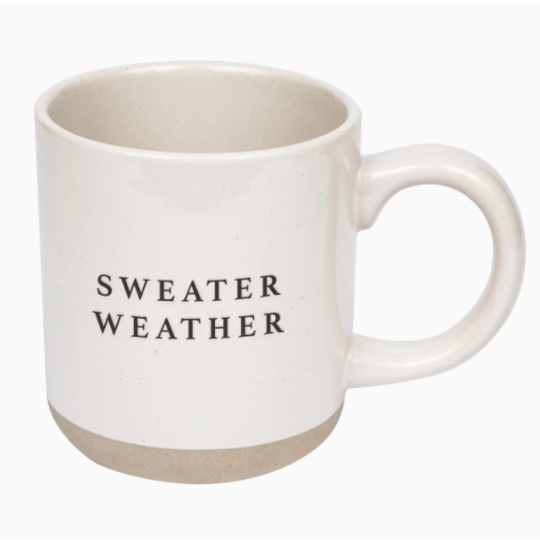 A 14-ounce stoneware mug adorned with the phrase "SWEATER WEATHER," showcasing its durable design and comfortable handle, perfect for enjoying coffee, tea, or hot cocoa during the cozy autumn and winter seasons.