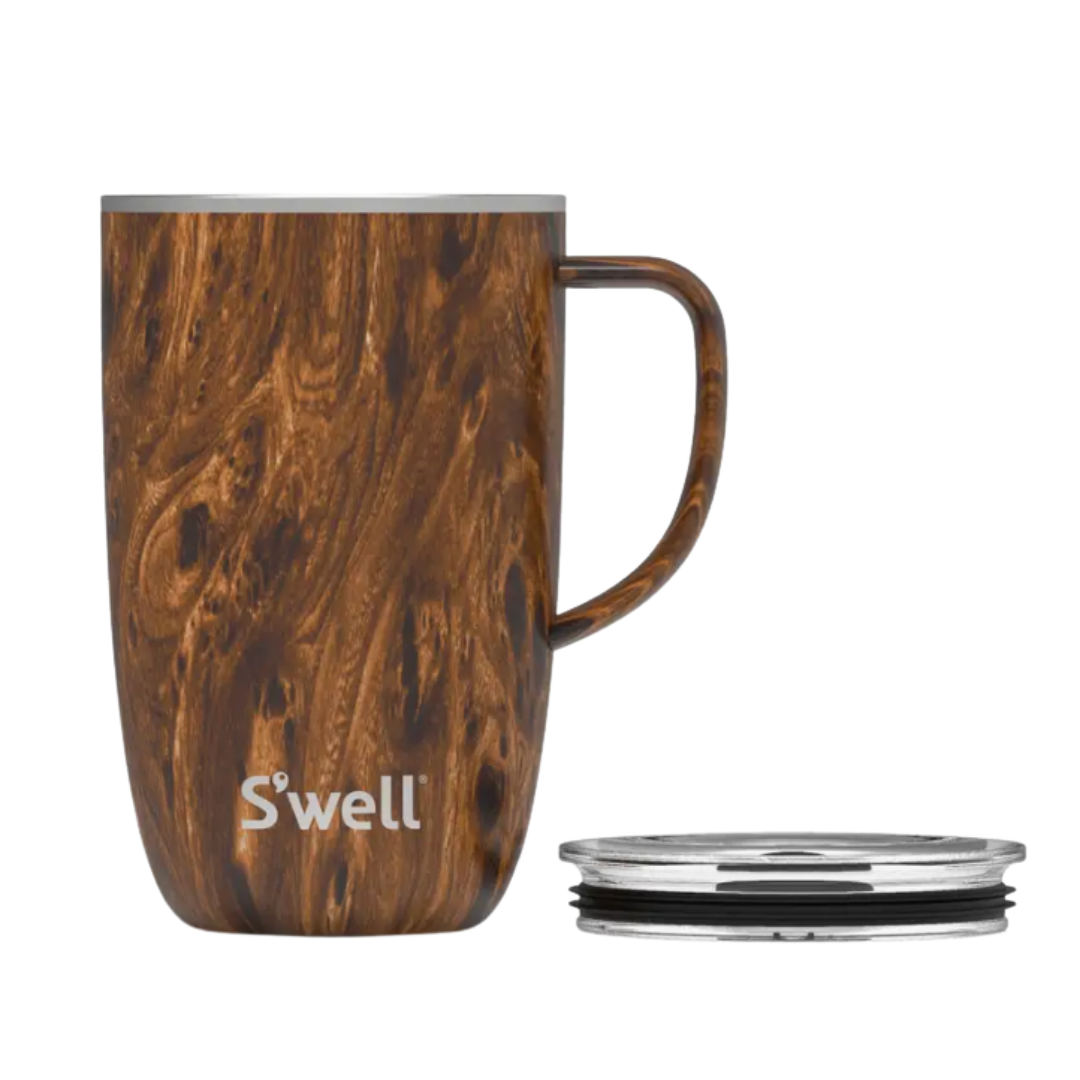 Stainless steel tumbler mug with teakwood accents, featuring a 16oz capacity and a handle. This S'well tumbler includes a slide-open lid with a splash-proof design, triple-layered Therma-S'well® technology for superior temperature retention, and a wide mouth that accommodates ice cubes. The condensation-free exterior prevents sweating, making it ideal for home or travel. Made from 18/8 food-grade stainless steel, it's BPA/BPS-free, reusable, and dishwasher safe.