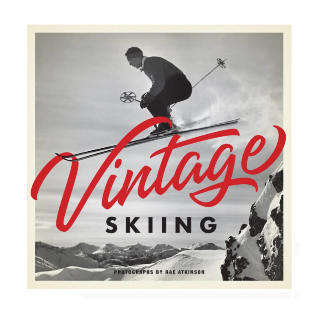 Hardcover coffee table book showcasing black-and-white vintage ski photos, featuring stunning historical images of skiing from the mid-20th century.