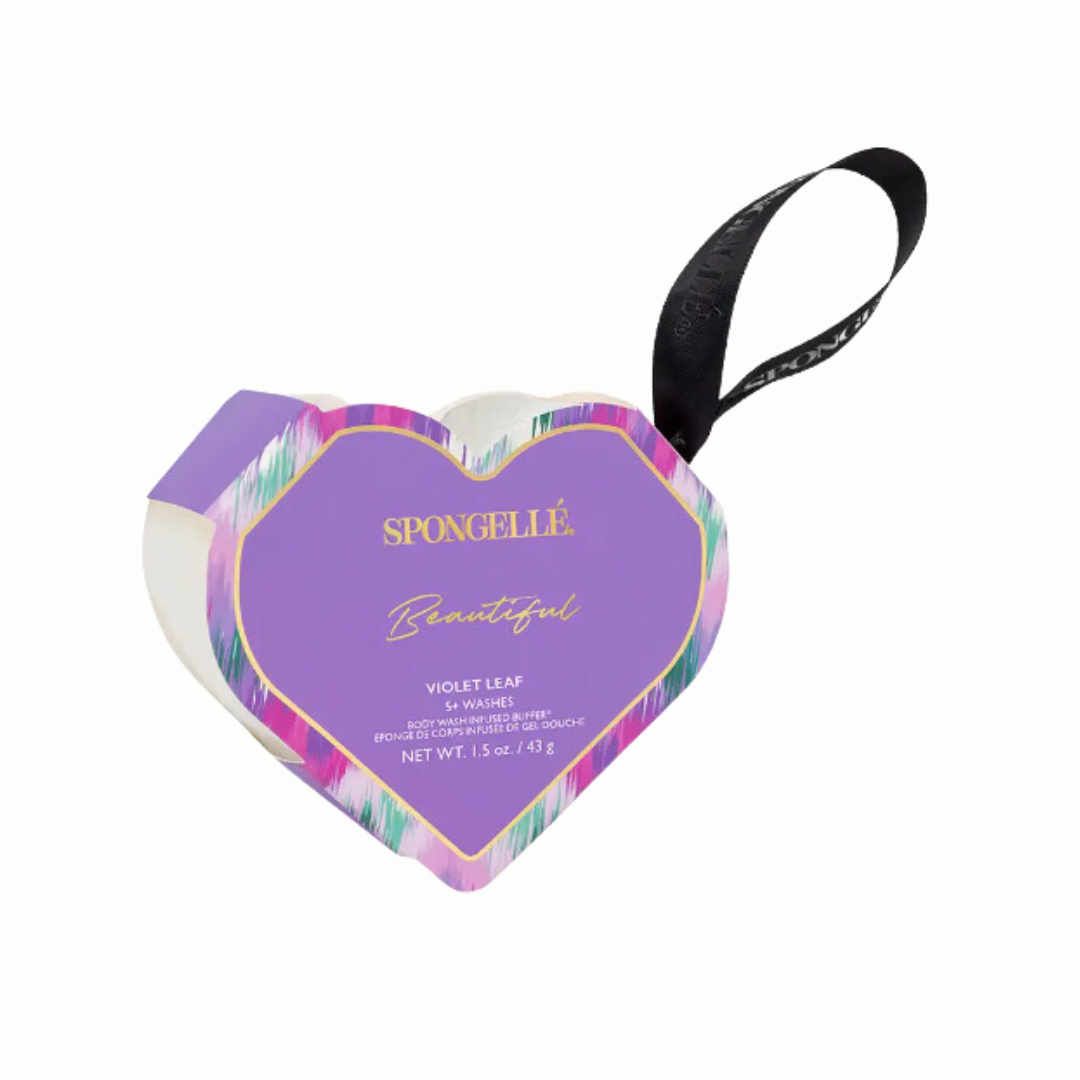 A collection of Spongellé’s heart-shaped body wash buffers, enriched with skin-softening extracts. The buffers are shown with a luxurious texture, designed to cleanse, exfoliate, massage, and nourish the skin. They are depicted in a way that highlights their elegant shape and multi-functional skincare benefits.