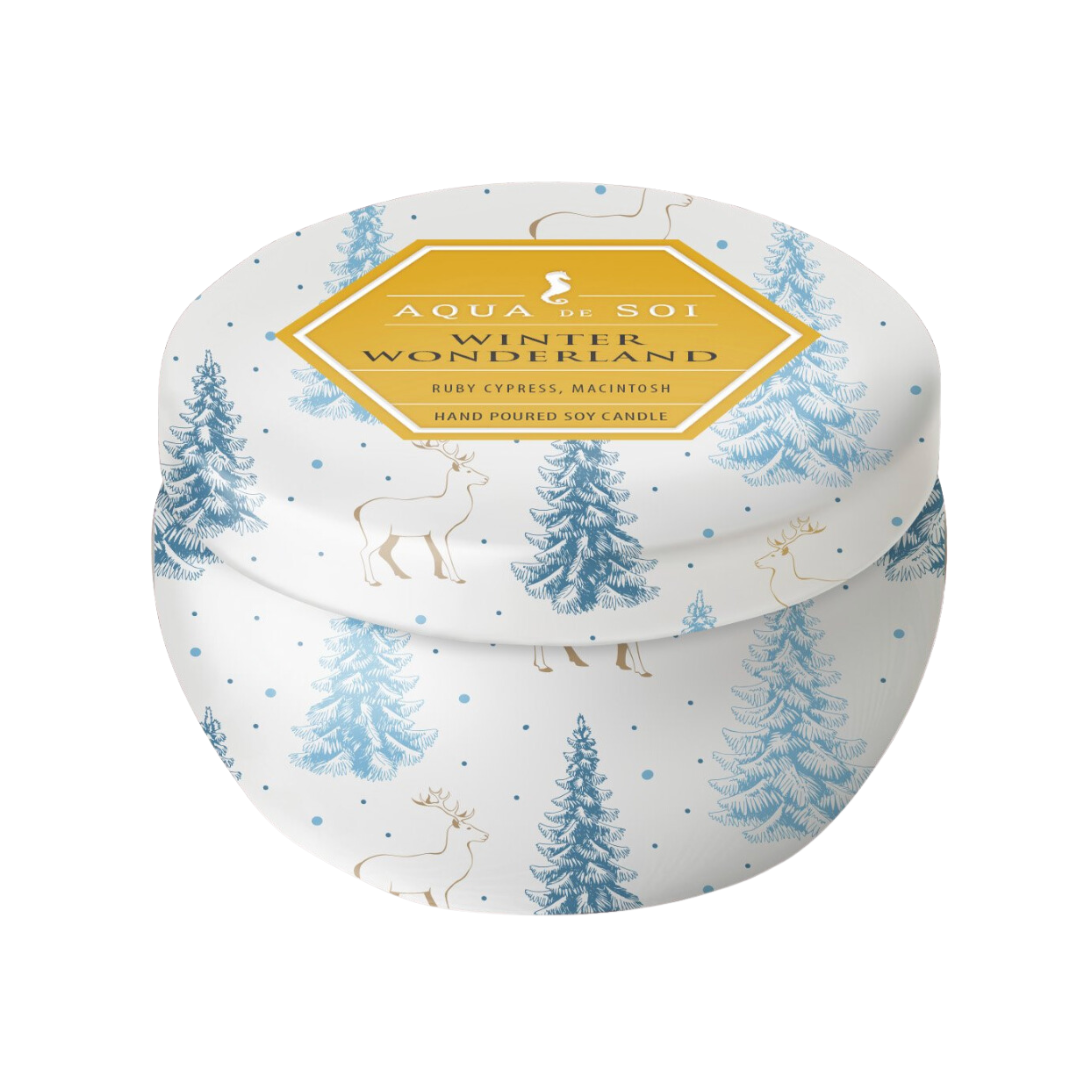 Winter Wonderland natural soy candle in a blue and white tin with matching lid. The tin it white with blue snow covered trees and gold deer.