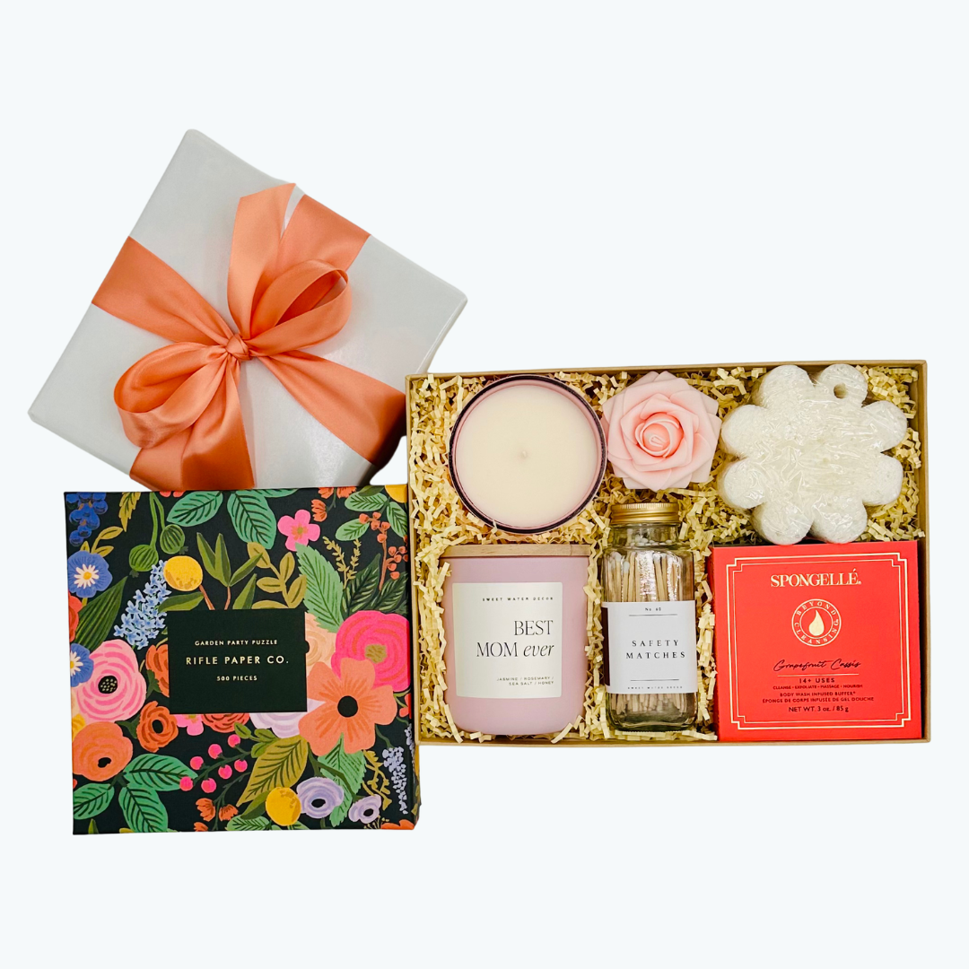 Gift set with candle, matches, and puzzle on a white background.