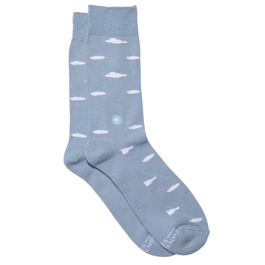 Light blue socks with white cloud pattern on a white background