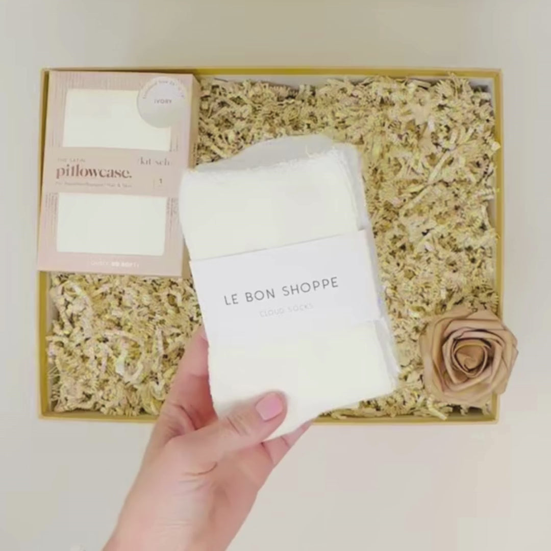 Indulge in serene nights with Satin Dreams Me To You Box: satin pillowcase, face mask, cozy socks, eye mask, and sleep mist for ultimate relaxation.