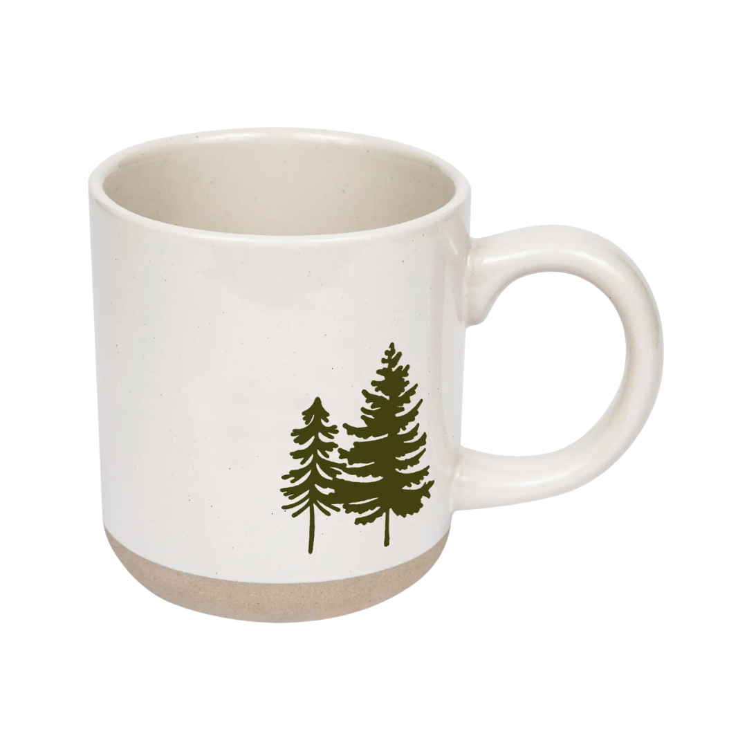 White mug with green tree design on a white background.