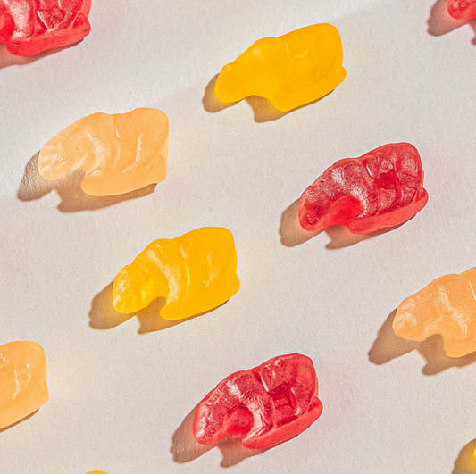 Colorful assortment of 4oz California Mixed Fruit Gummy Bears, featuring a blend of vibrant flavors like cherry, orange, grape, and lemon.