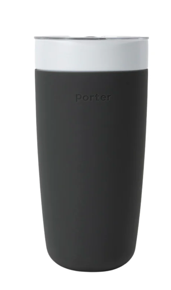 Black 20 oz ceramic reusable tumbler with sliding lid, encased in durable black silicone wrap for secure grip and insulation.