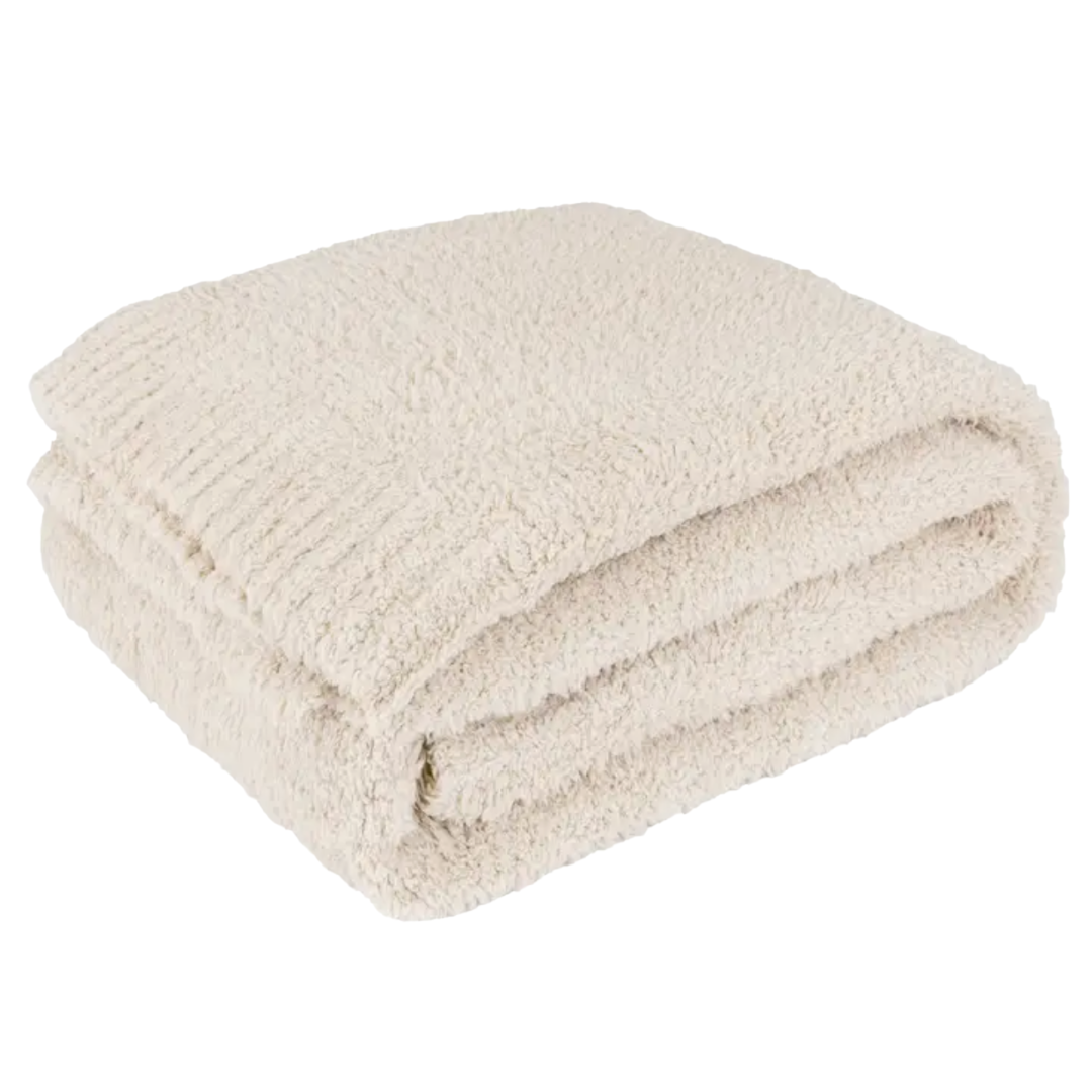 Cream-colored 50"x60" fleece blanket with soft knit texture for warmth and comfort.