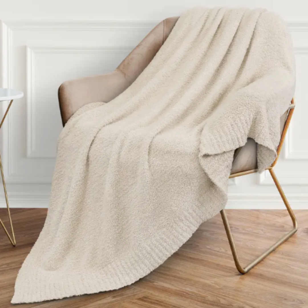 Creamy soft knit fleece blanket, 50"x60", with cozy fuzzy texture for ultimate comfort and warmth.