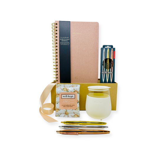 A close-up image of Me To You Box's Office Essentials curated gift box, featuring a selection of high-quality office supplies neatly arranged.