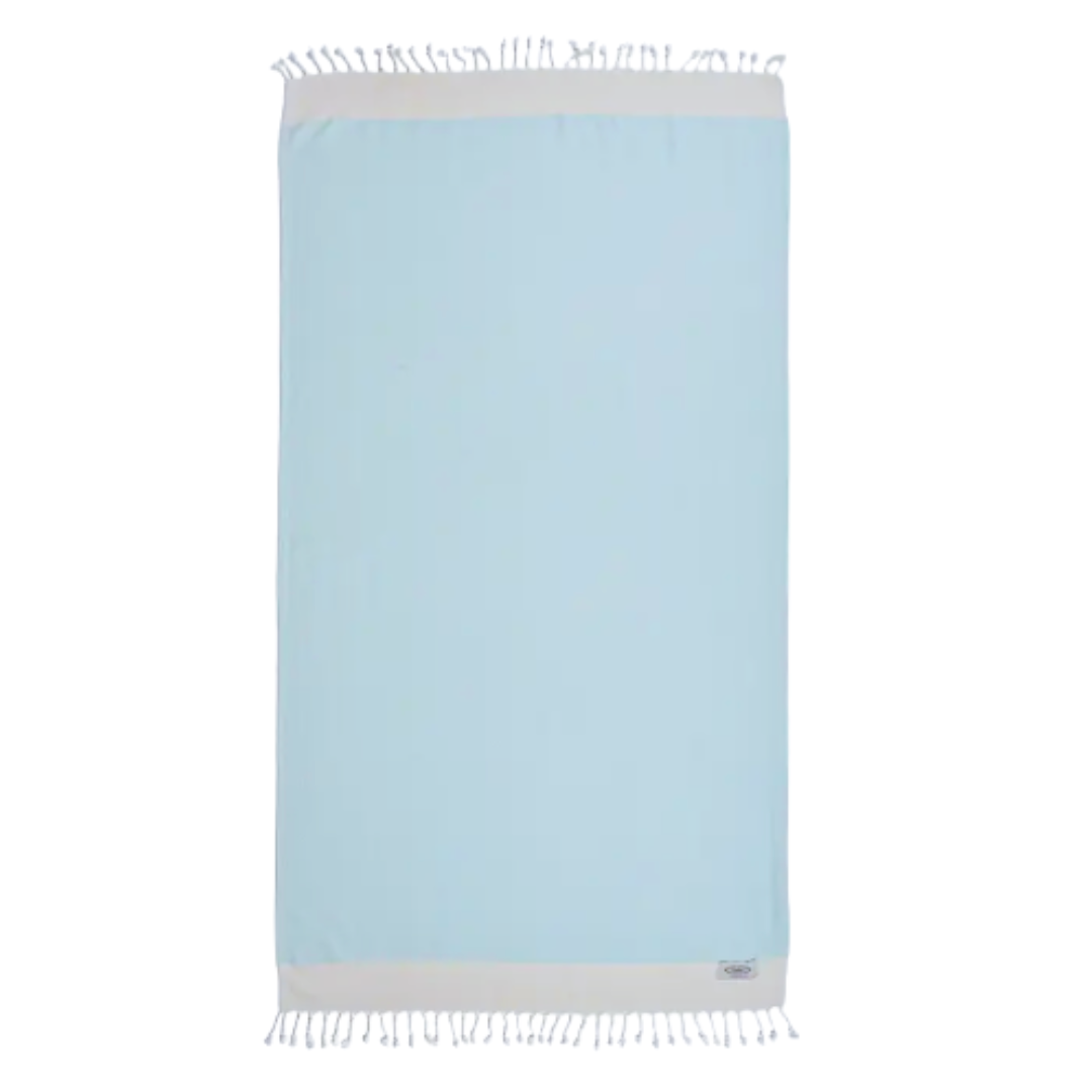 Sumptuous Turkish cotton towel in tranquil blue and cream, ideal for beachside lounging.