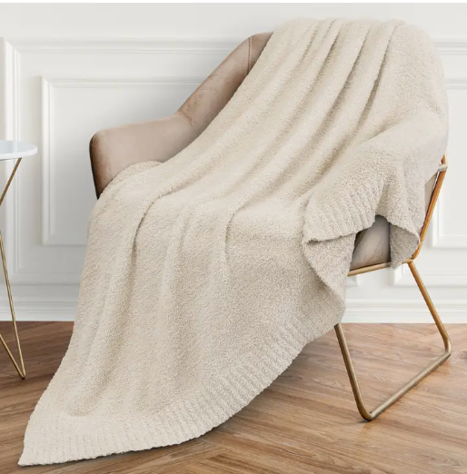 Luxurious 50"x60" buttery-soft blanket, perfect for cozying up.